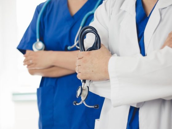 Doctors with stethoscopes in uniform.