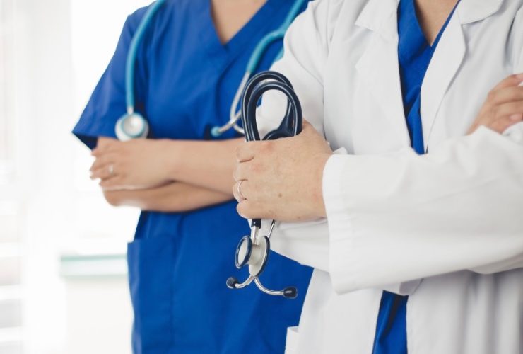 Doctors with stethoscopes in uniform.