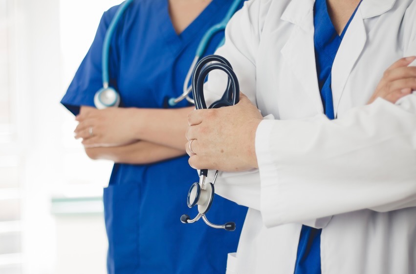 Doctors with stethoscopes in uniform.