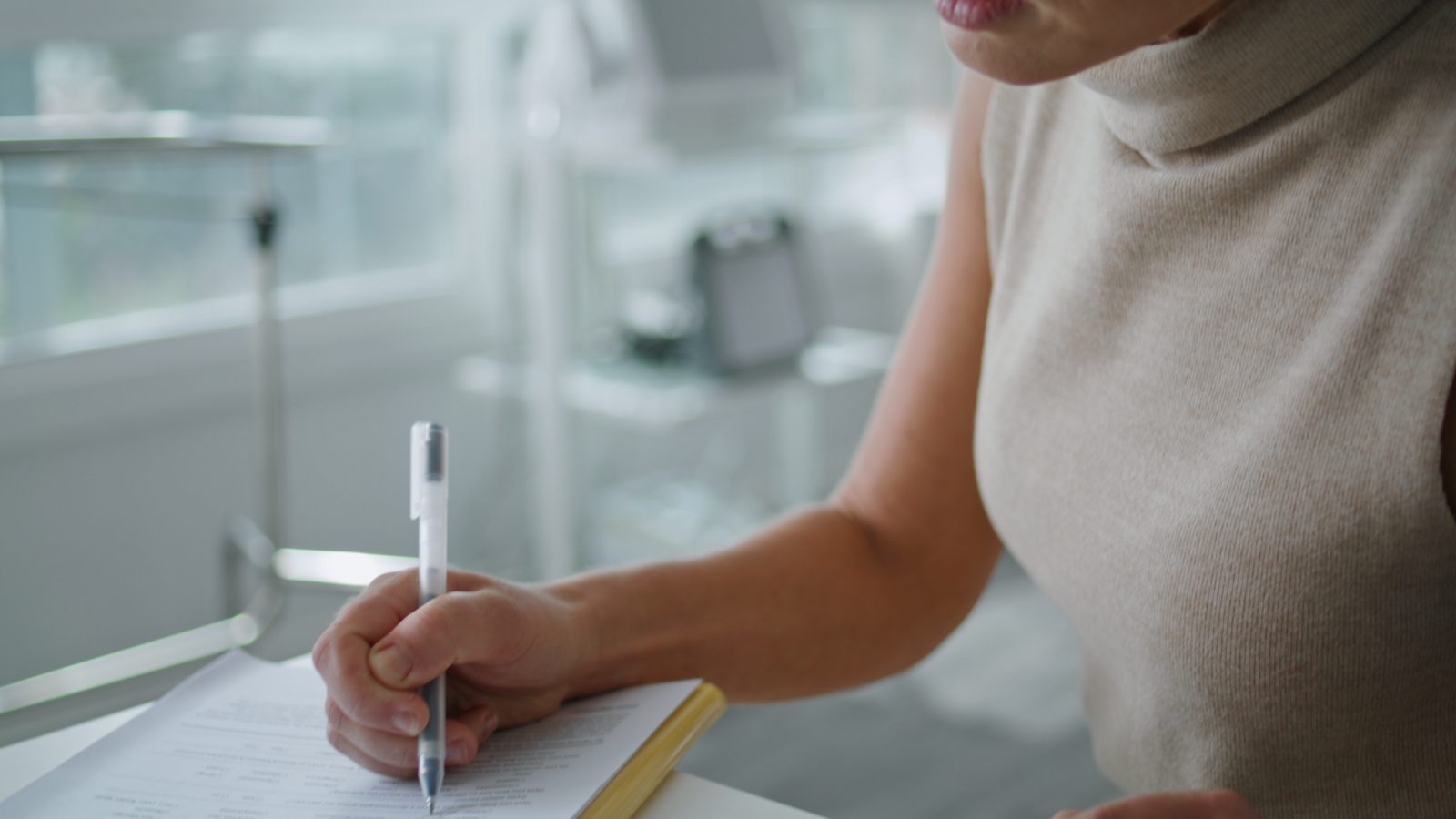 Doctor signing a contract.