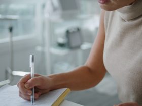 Doctor signing a contract.