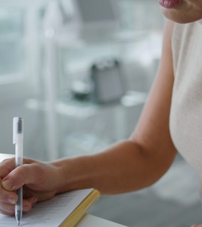 Doctor signing a contract.