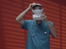 Artificial intelligence is demonstrated by a physician donning a virtual reality headset.